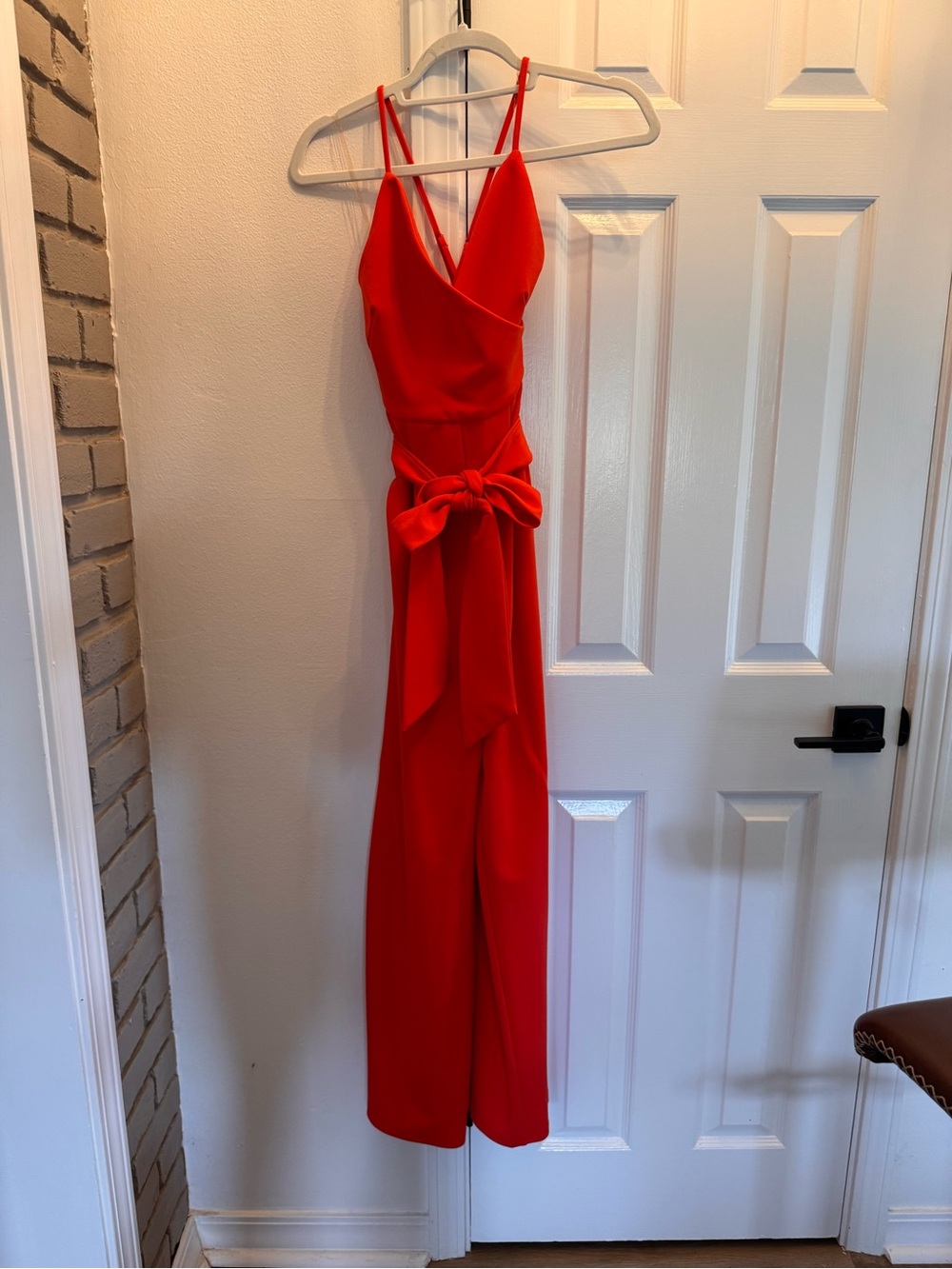 Sunset Orange V-Neck Jumpsuit with Waist Bow
